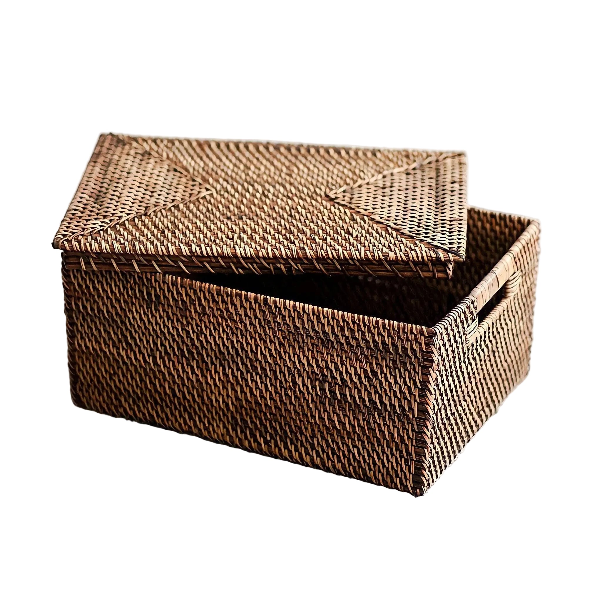 Close-up of high-quality dark brown wicker weave on a rectangular storage container with sturdy handles and lid. lid.